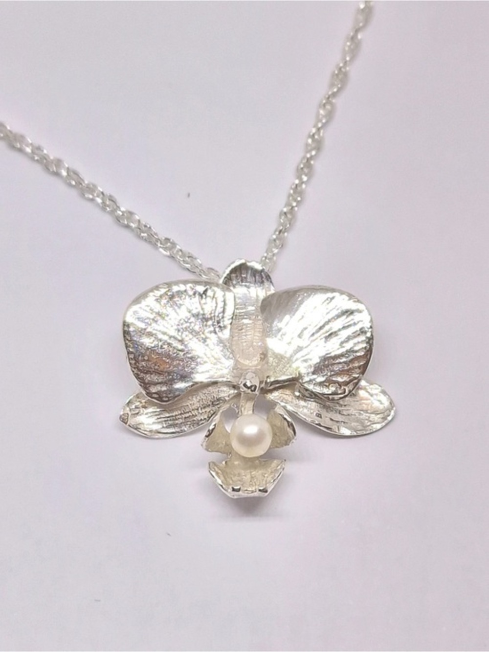 Silver Orchid Pendant Necklace with Pearl Accent